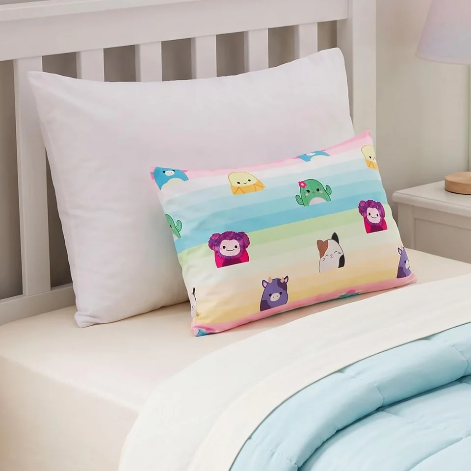 Rainbow Party small kids pillow on a bed